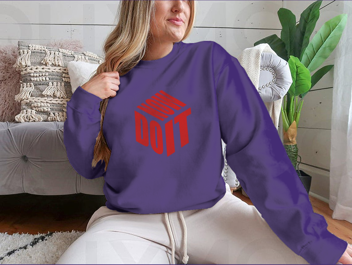 A motivational sweatshirt featuring the phrase 'Do It Now' in a simple design, made from a comfortable cotton/polyester blend.