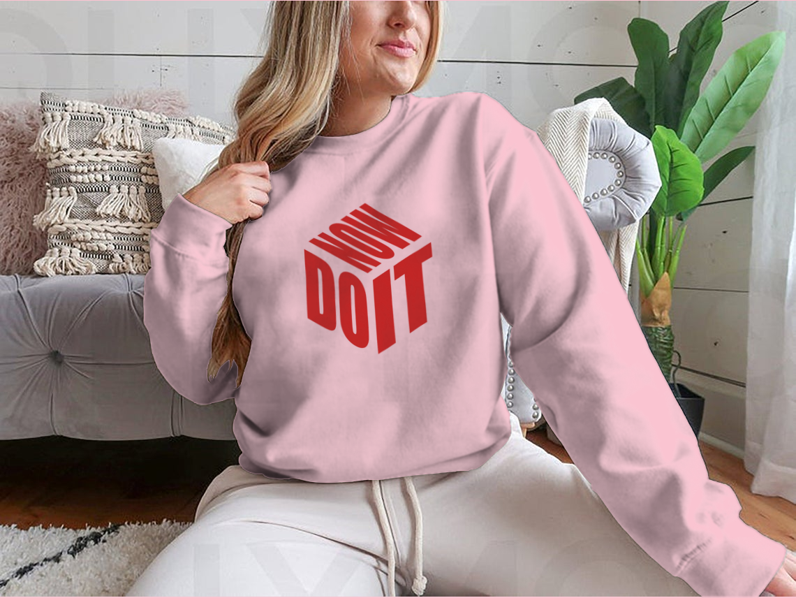 A motivational sweatshirt featuring the phrase 'Do It Now' in a simple design, made from a comfortable cotton/polyester blend.