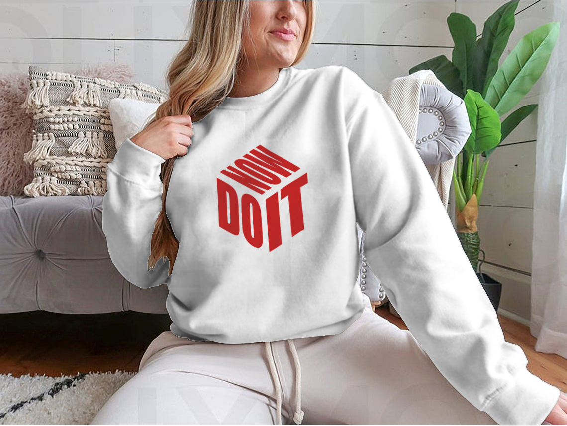 A motivational sweatshirt featuring the phrase 'Do It Now' in a simple design, made from a comfortable cotton/polyester blend.