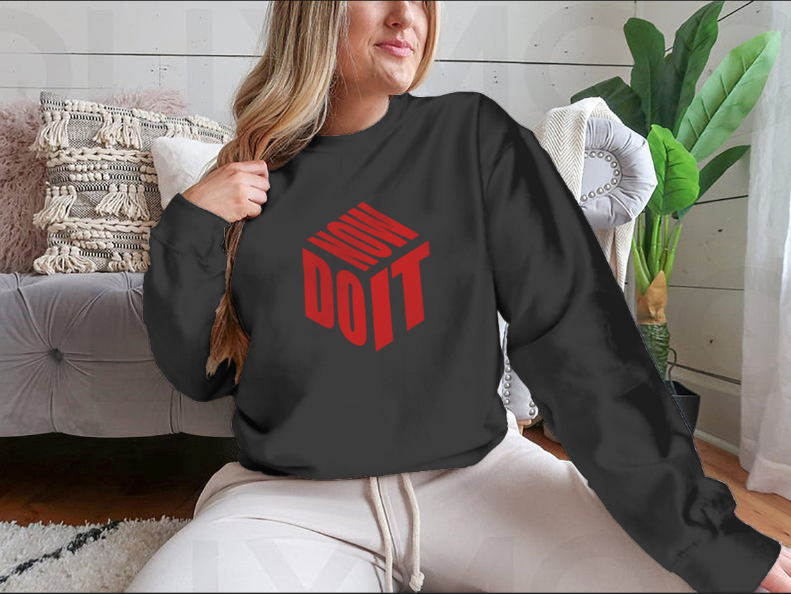 A motivational sweatshirt featuring the phrase 'Do It Now' in a simple design, made from a comfortable cotton/polyester blend.