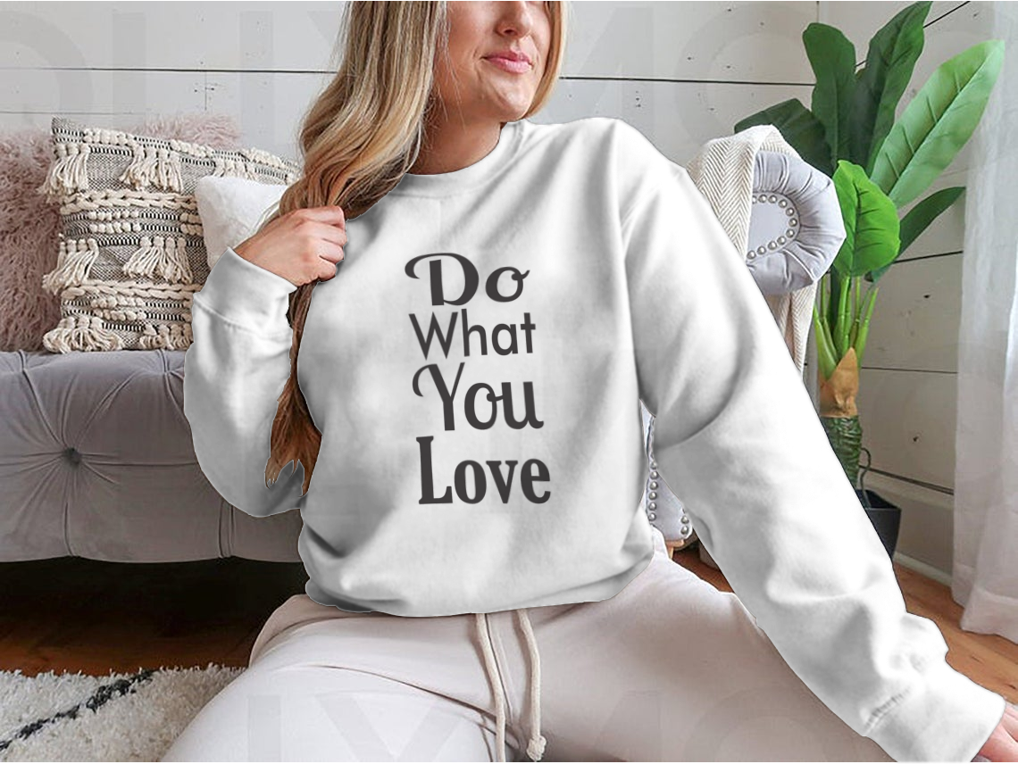 A cozy sweatshirt featuring the inspirational quote 'Do What You Love' in stylish typography, made from soft cotton fabric.