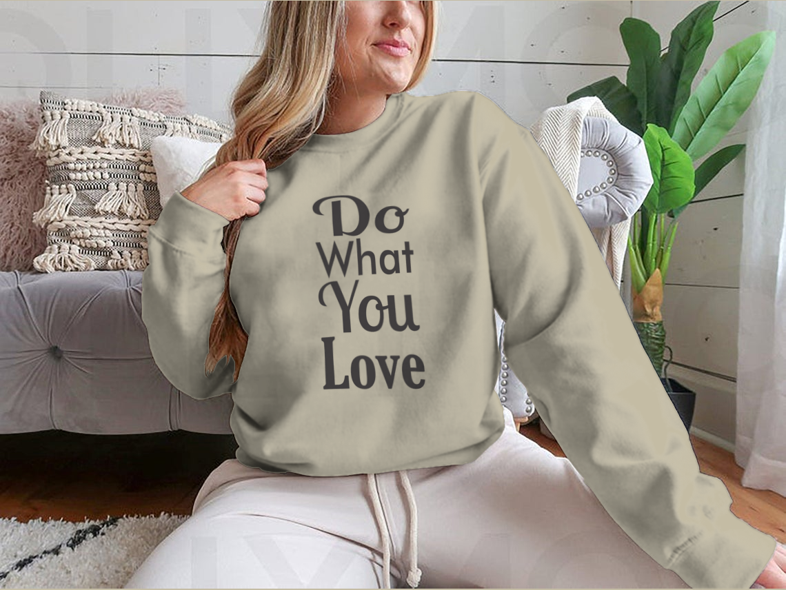 A cozy sweatshirt featuring the inspirational quote 'Do What You Love' in stylish typography, made from soft cotton fabric.