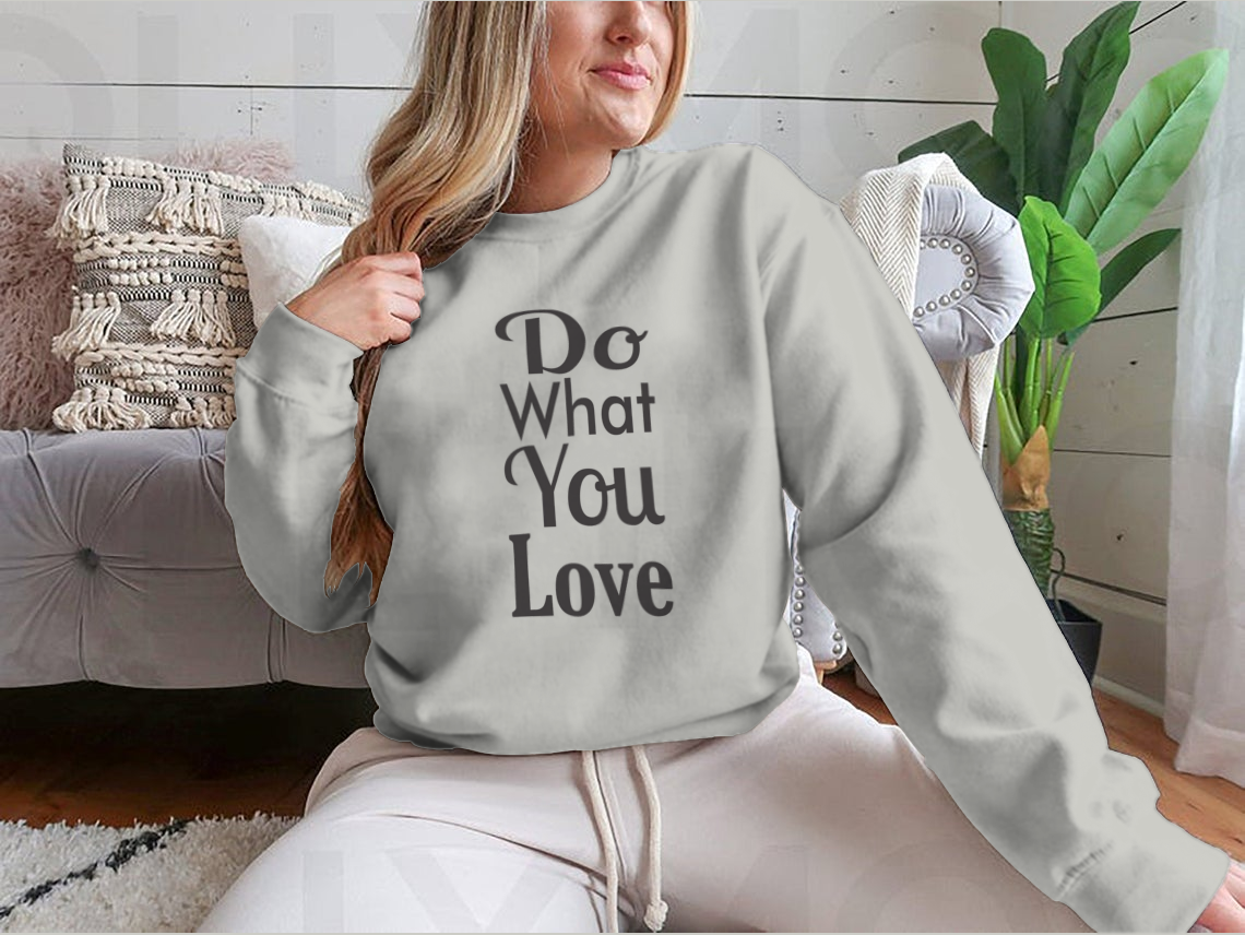 A cozy sweatshirt featuring the inspirational quote 'Do What You Love' in stylish typography, made from soft cotton fabric.