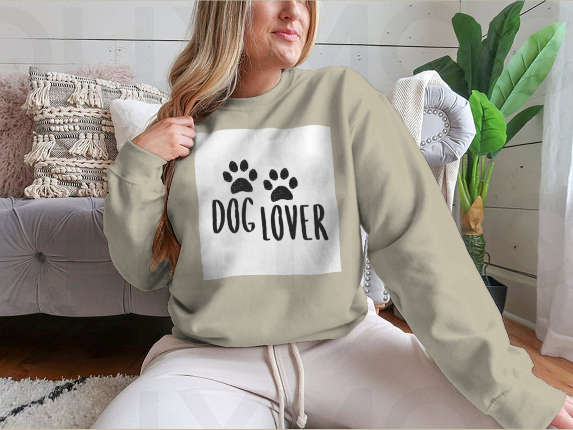 A stylish Dog Lover Cartoon Typography shirt featuring a playful dog paws silhouette design, perfect for dog enthusiasts.