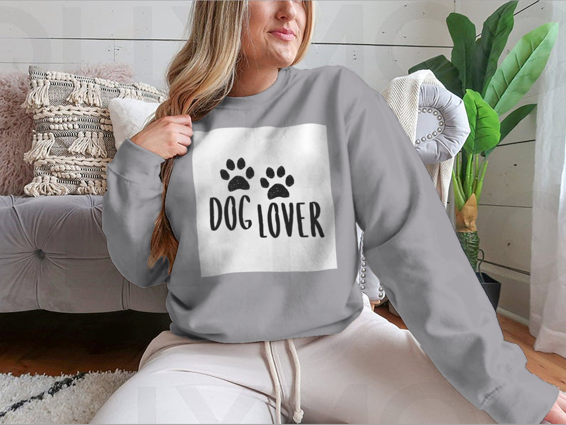 A stylish Dog Lover Cartoon Typography shirt featuring a playful dog paws silhouette design, perfect for dog enthusiasts.