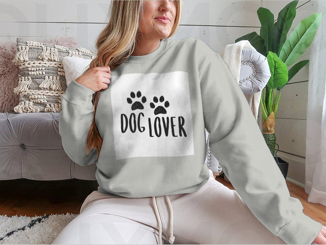 A stylish Dog Lover Cartoon Typography shirt featuring a playful dog paws silhouette design, perfect for dog enthusiasts.