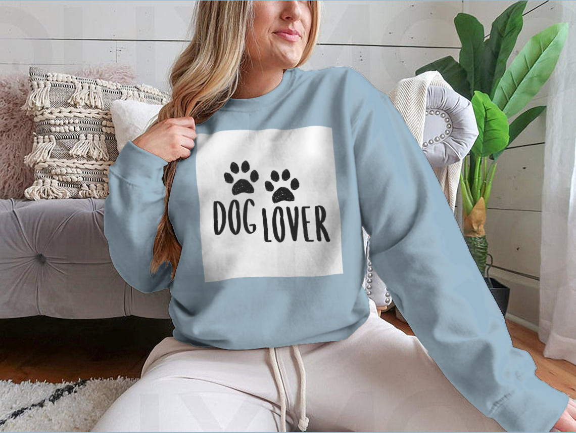 A stylish Dog Lover Cartoon Typography shirt featuring a playful dog paws silhouette design, perfect for dog enthusiasts.