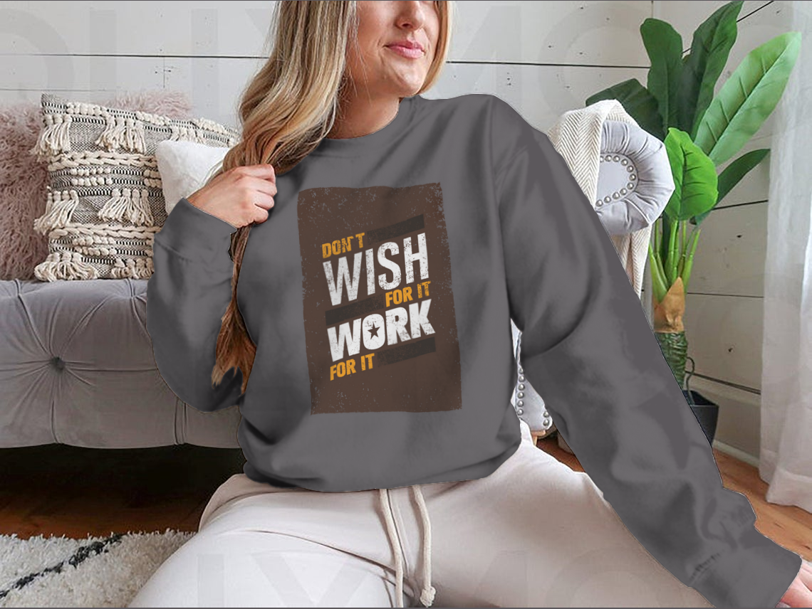 A stylish sweatshirt featuring the motivational quote 'Don't Wish For It, Work For It' in bold lettering, made from a soft cotton-polyester blend.