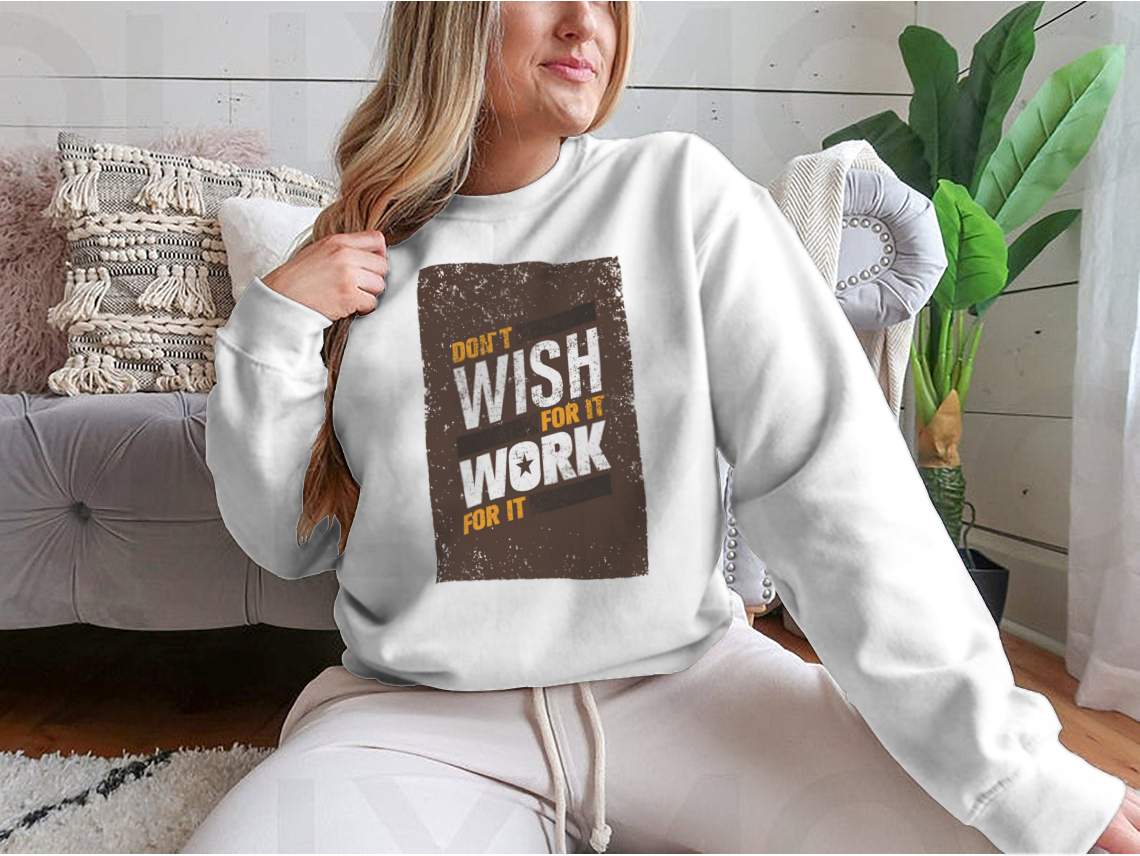 A stylish sweatshirt featuring the motivational quote 'Don't Wish For It, Work For It' in bold lettering, made from a soft cotton-polyester blend.