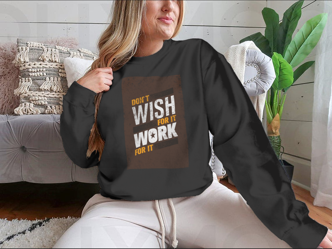 A stylish sweatshirt featuring the motivational quote 'Don't Wish For It, Work For It' in bold lettering, made from a soft cotton-polyester blend.