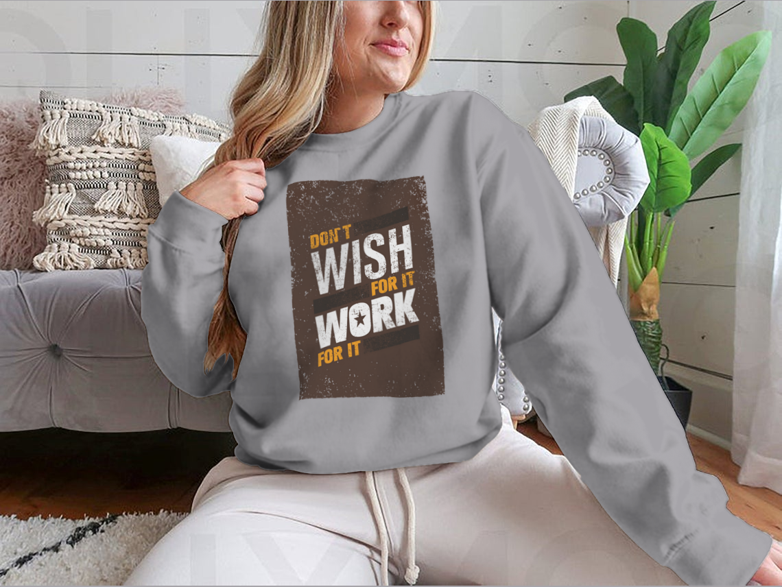 A stylish sweatshirt featuring the motivational quote 'Don't Wish For It, Work For It' in bold lettering, made from a soft cotton-polyester blend.