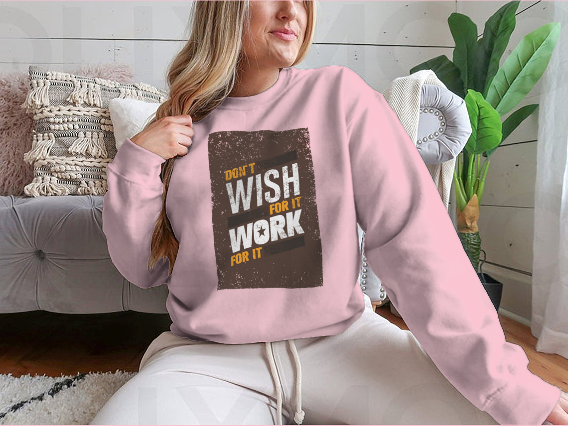 A stylish sweatshirt featuring the motivational quote 'Don't Wish For It, Work For It' in bold lettering, made from a soft cotton-polyester blend.