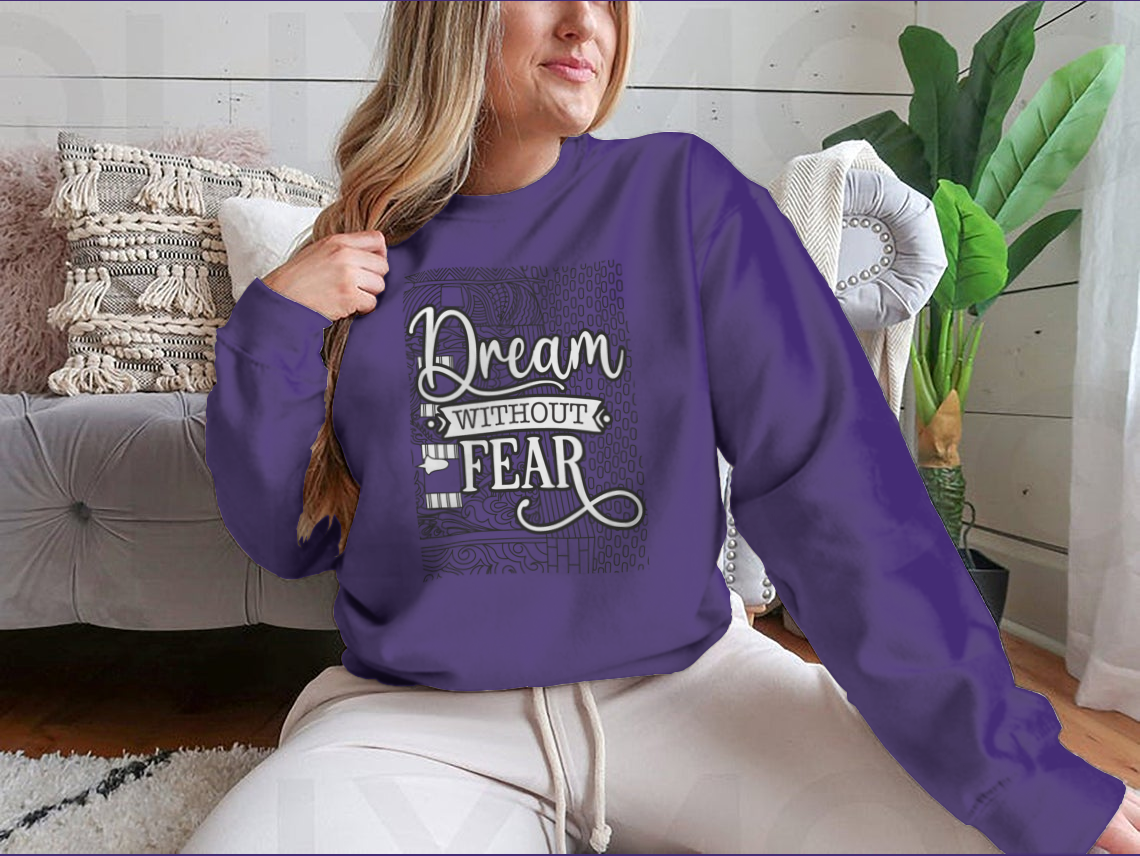 A cozy sweatshirt featuring the inspirational phrase 'Dream With Out Fear' in stylish typography, perfect for casual wear.