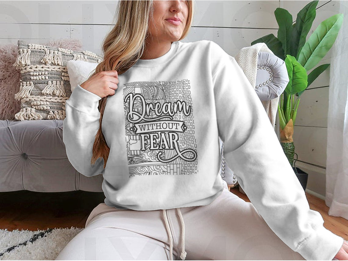 A cozy sweatshirt featuring the inspirational phrase 'Dream With Out Fear' in stylish typography, perfect for casual wear.