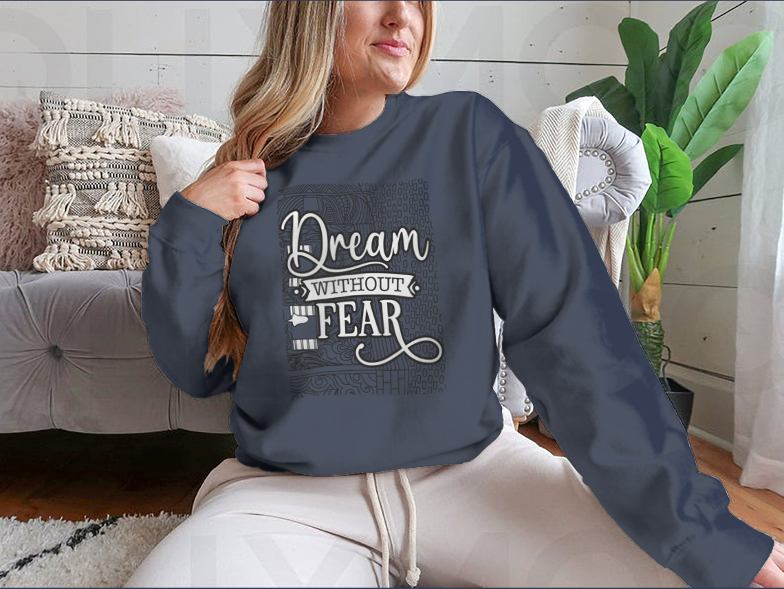 A cozy sweatshirt featuring the inspirational phrase 'Dream With Out Fear' in stylish typography, perfect for casual wear.