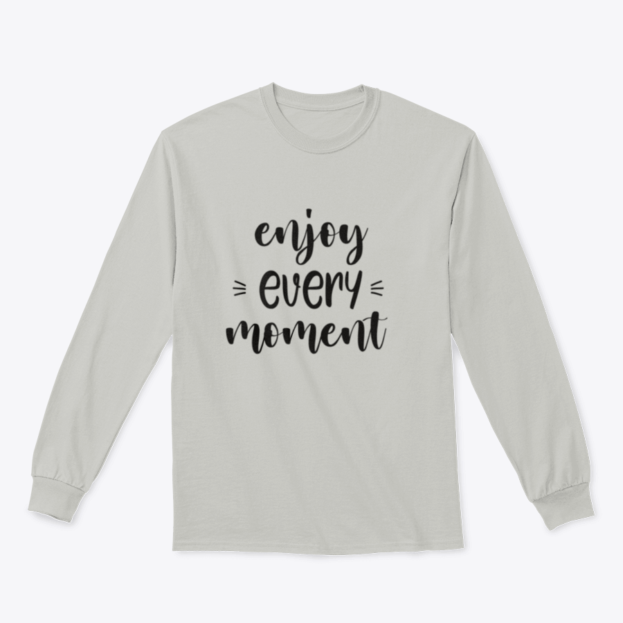 A cozy sweatshirt featuring brush lettering design that reads 'Enjoy Every Moment', made from soft cotton fabric.