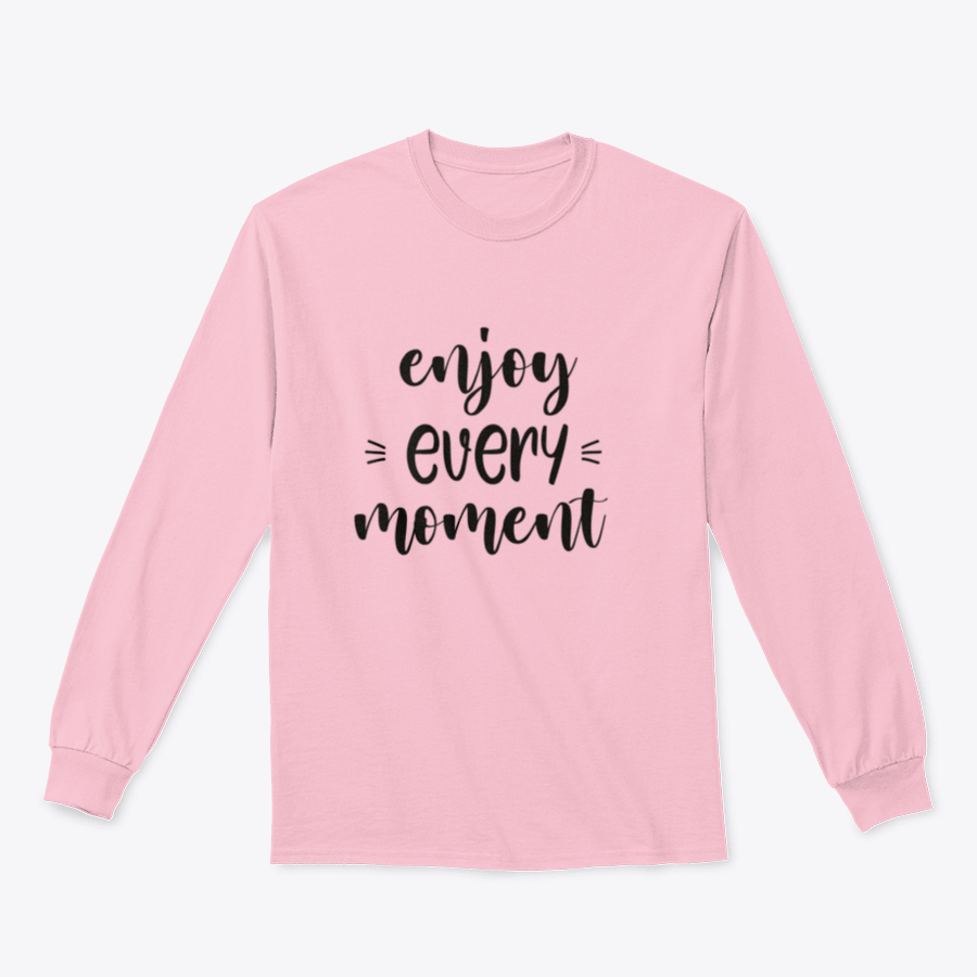 A cozy sweatshirt featuring brush lettering design that reads 'Enjoy Every Moment', made from soft cotton fabric.