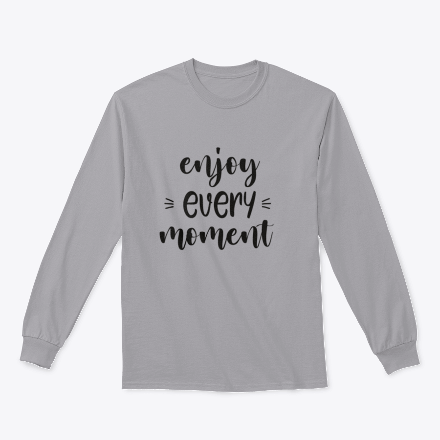 A cozy sweatshirt featuring brush lettering design that reads 'Enjoy Every Moment', made from soft cotton fabric.