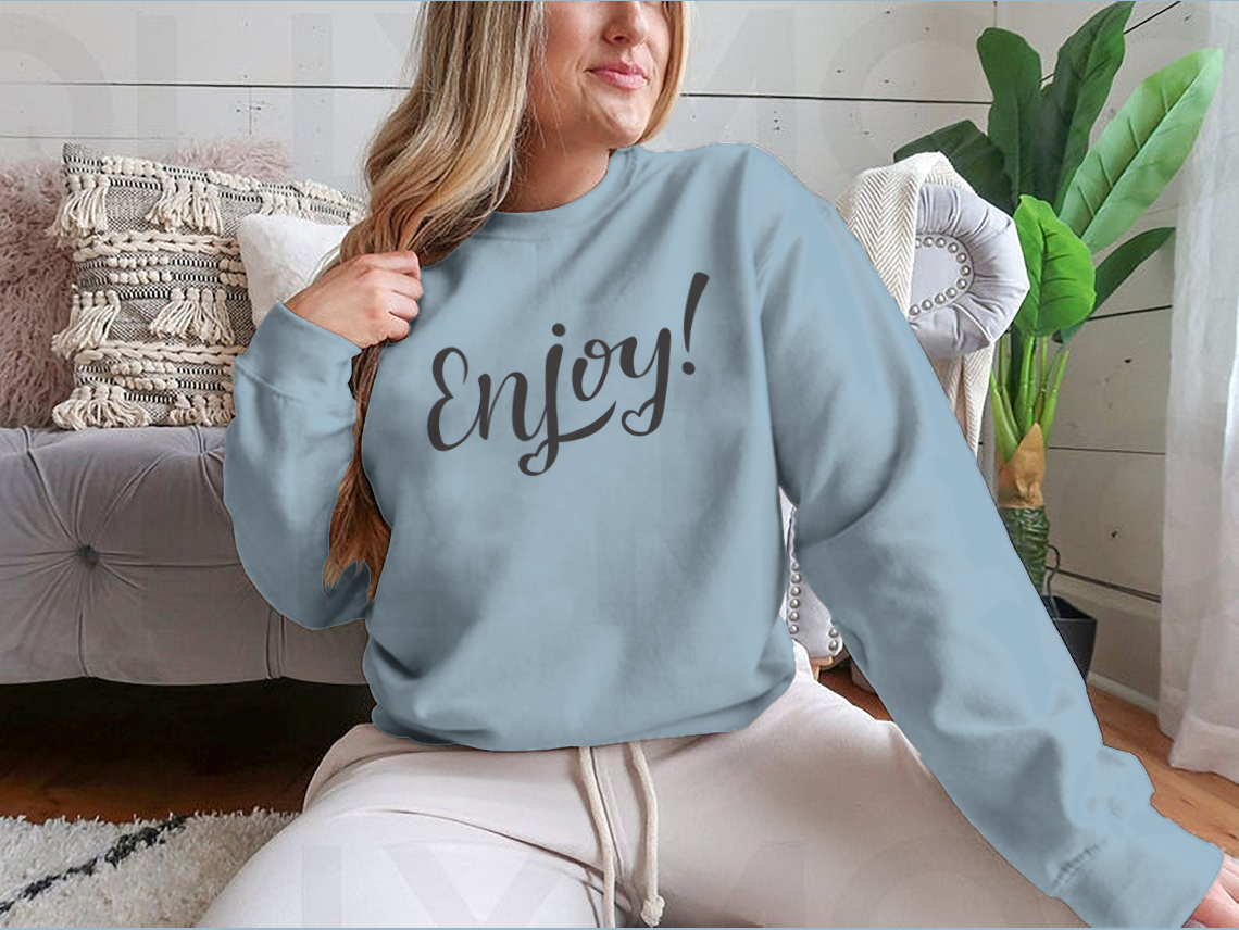 A cozy sweatshirt featuring hand-drawn lettering with motivational designs, showcasing a classic fit and soft fabric blend.