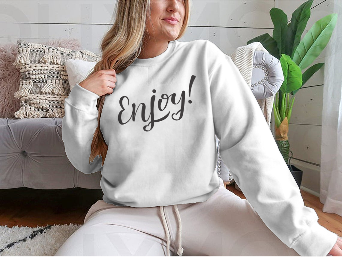 A cozy sweatshirt featuring hand-drawn lettering with motivational designs, showcasing a classic fit and soft fabric blend.