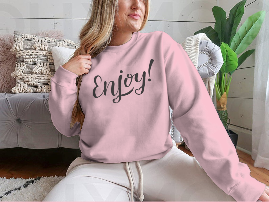 A cozy sweatshirt featuring hand-drawn lettering with motivational designs, showcasing a classic fit and soft fabric blend.