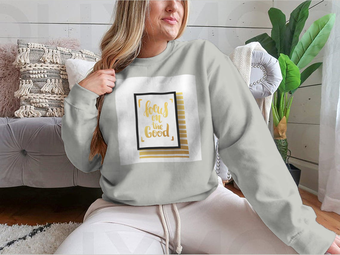 A cozy sweatshirt featuring the inspirational phrase 'Focus On The Good', made from a soft cotton-polyester blend.