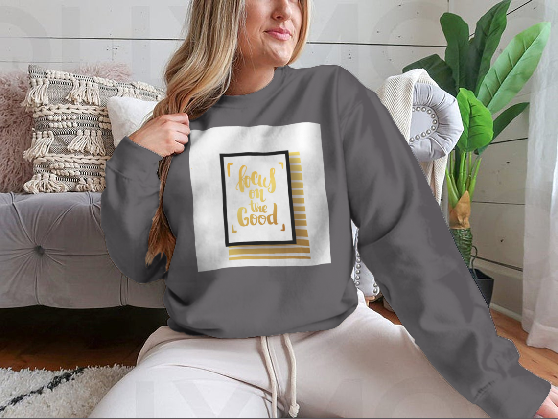 A cozy sweatshirt featuring the inspirational phrase 'Focus On The Good', made from a soft cotton-polyester blend.