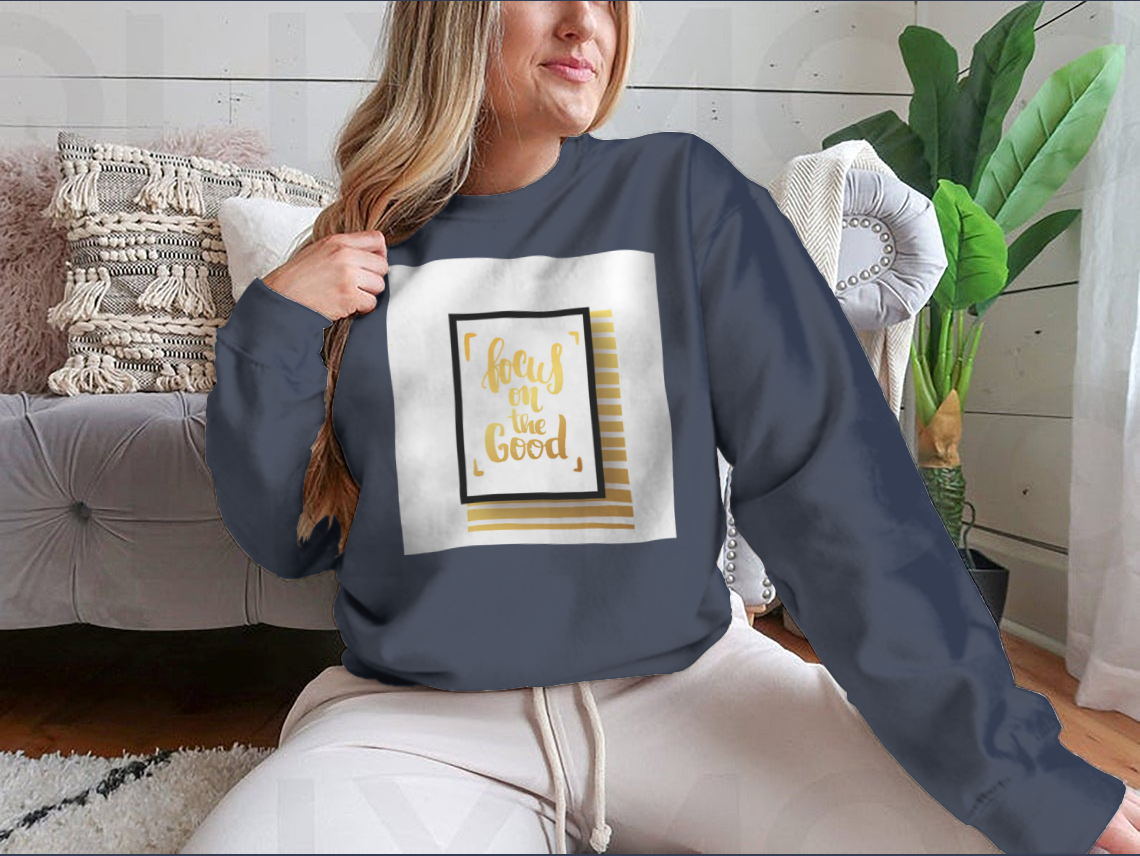 A cozy sweatshirt featuring the inspirational phrase 'Focus On The Good', made from a soft cotton-polyester blend.