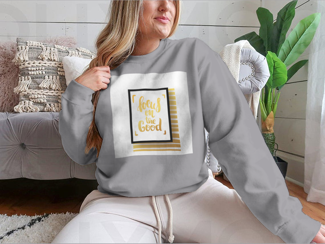 A cozy sweatshirt featuring the inspirational phrase 'Focus On The Good', made from a soft cotton-polyester blend.