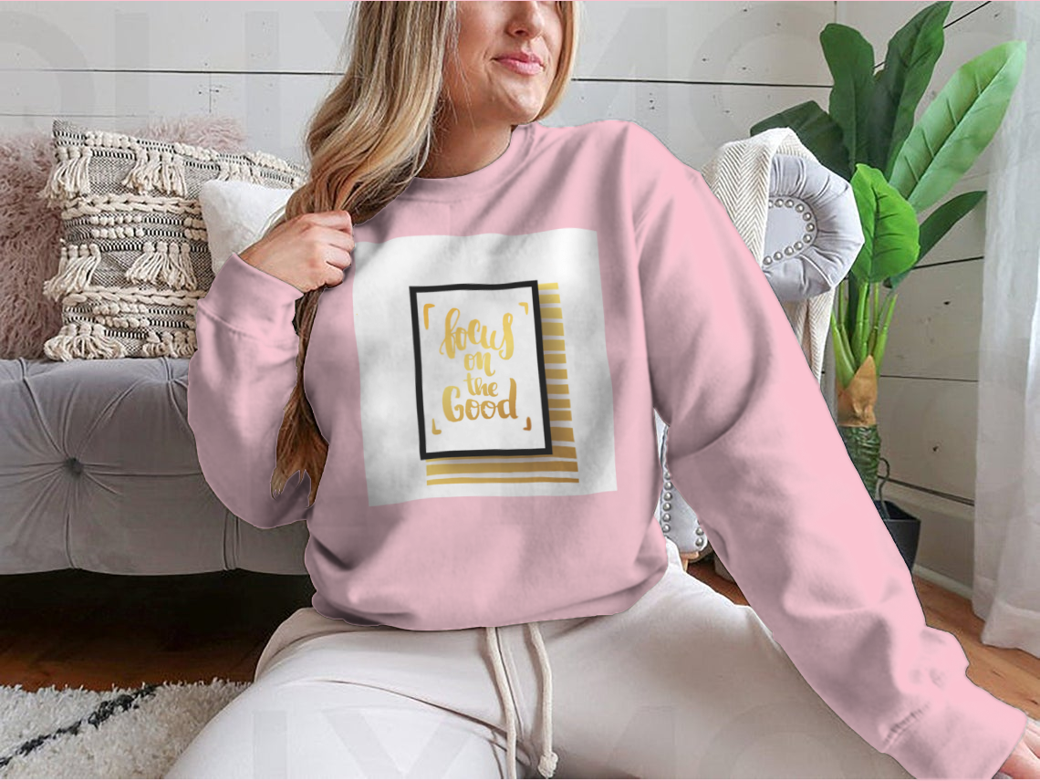 A cozy sweatshirt featuring the inspirational phrase 'Focus On The Good', made from a soft cotton-polyester blend.