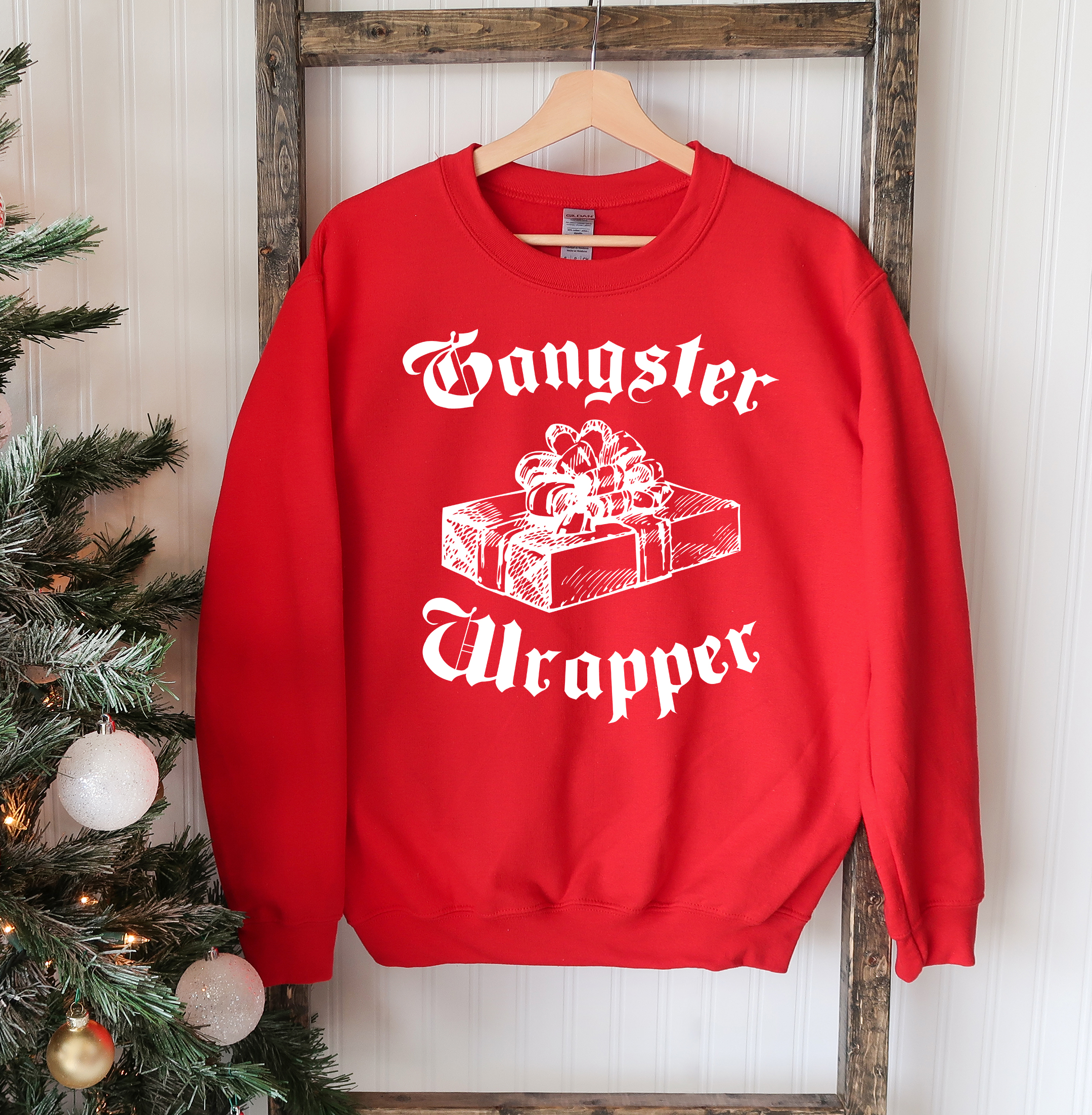 Gangsta Wrapper Christmas Sweatshirt featuring a crew neck design, soft fabric, and festive holiday theme, perfect for winter wear.