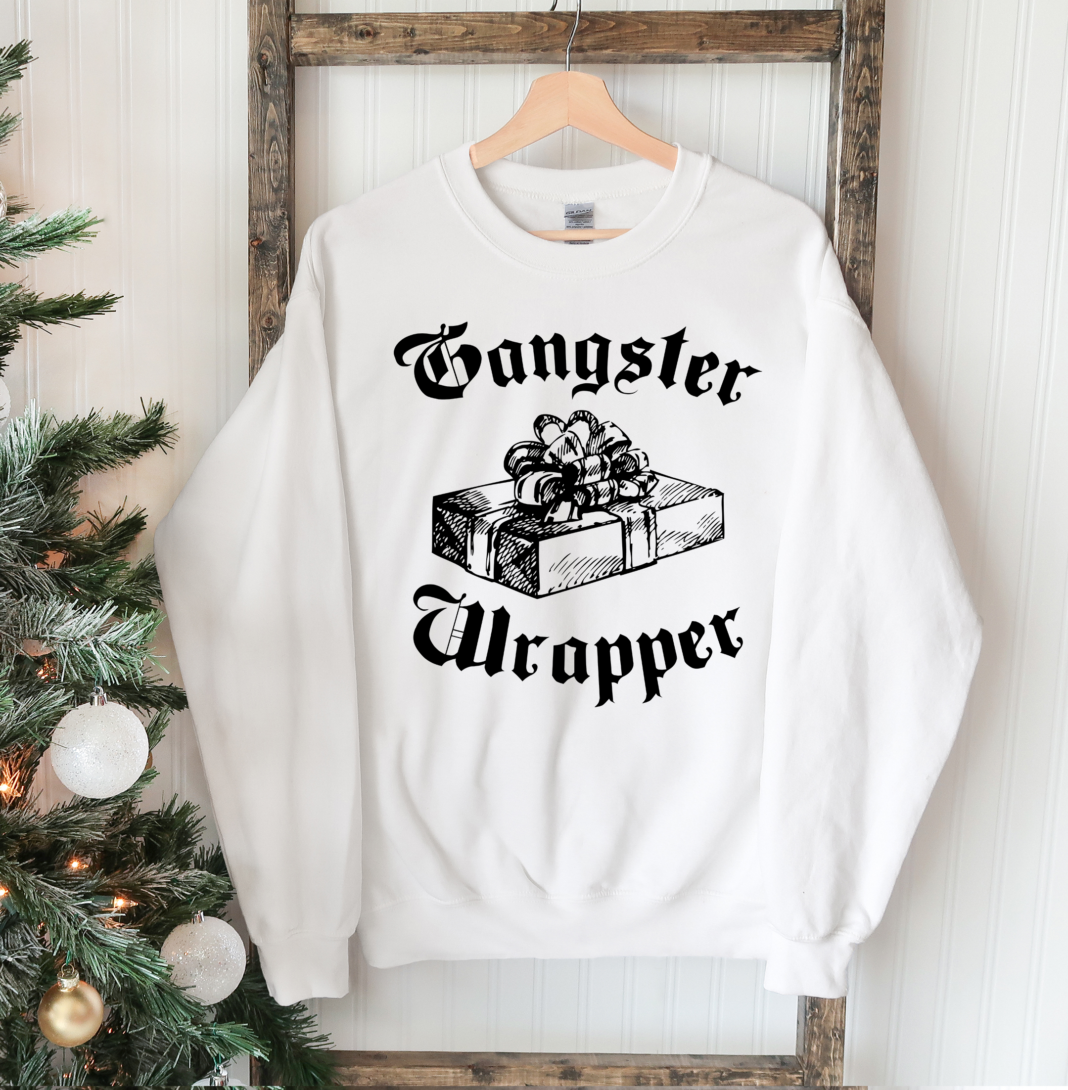 Gangsta Wrapper Christmas Sweatshirt featuring a crew neck design, soft fabric, and festive holiday theme, perfect for winter wear.