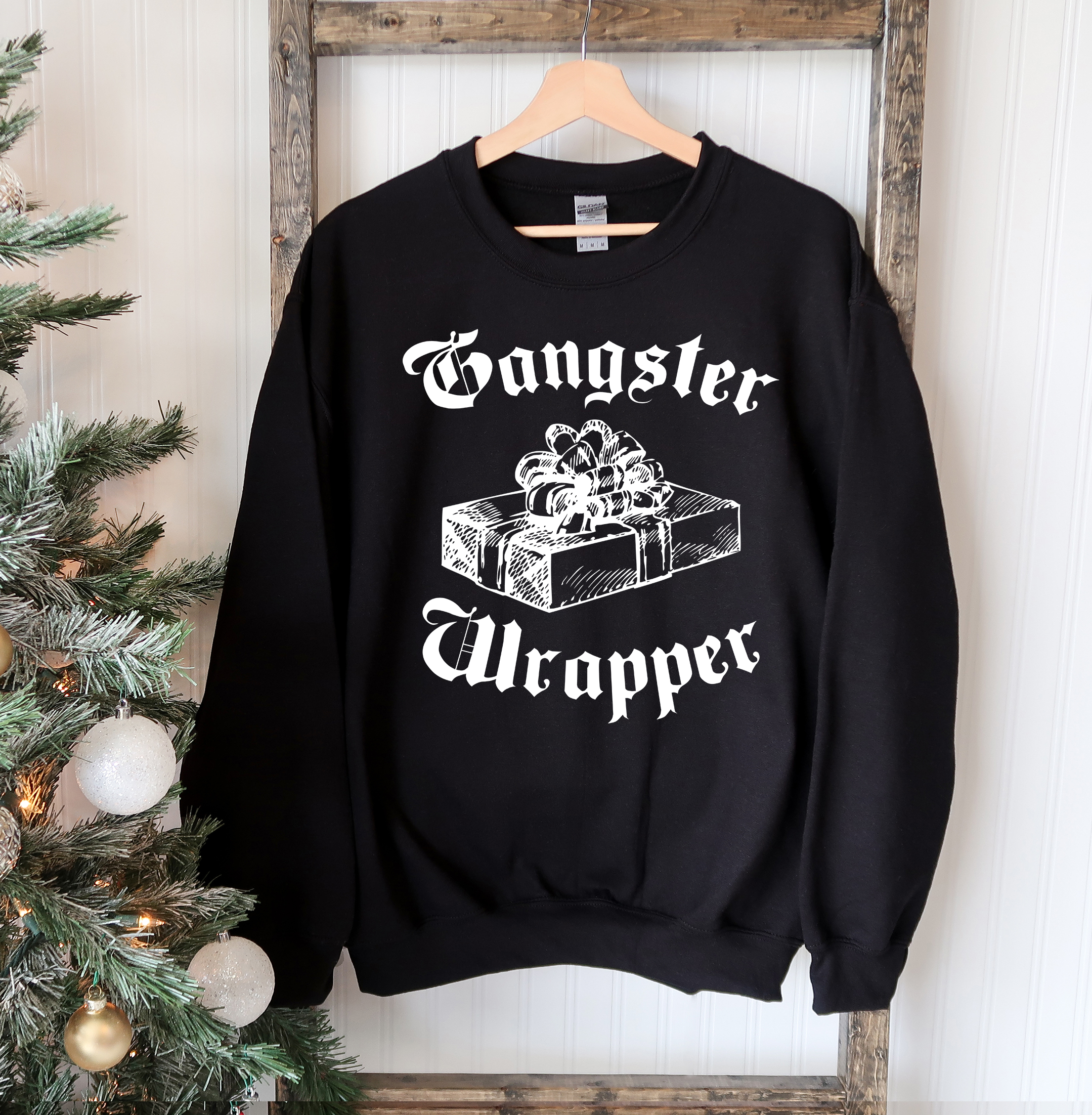 Gangsta Wrapper Christmas Sweatshirt featuring a crew neck design, soft fabric, and festive holiday theme, perfect for winter wear.