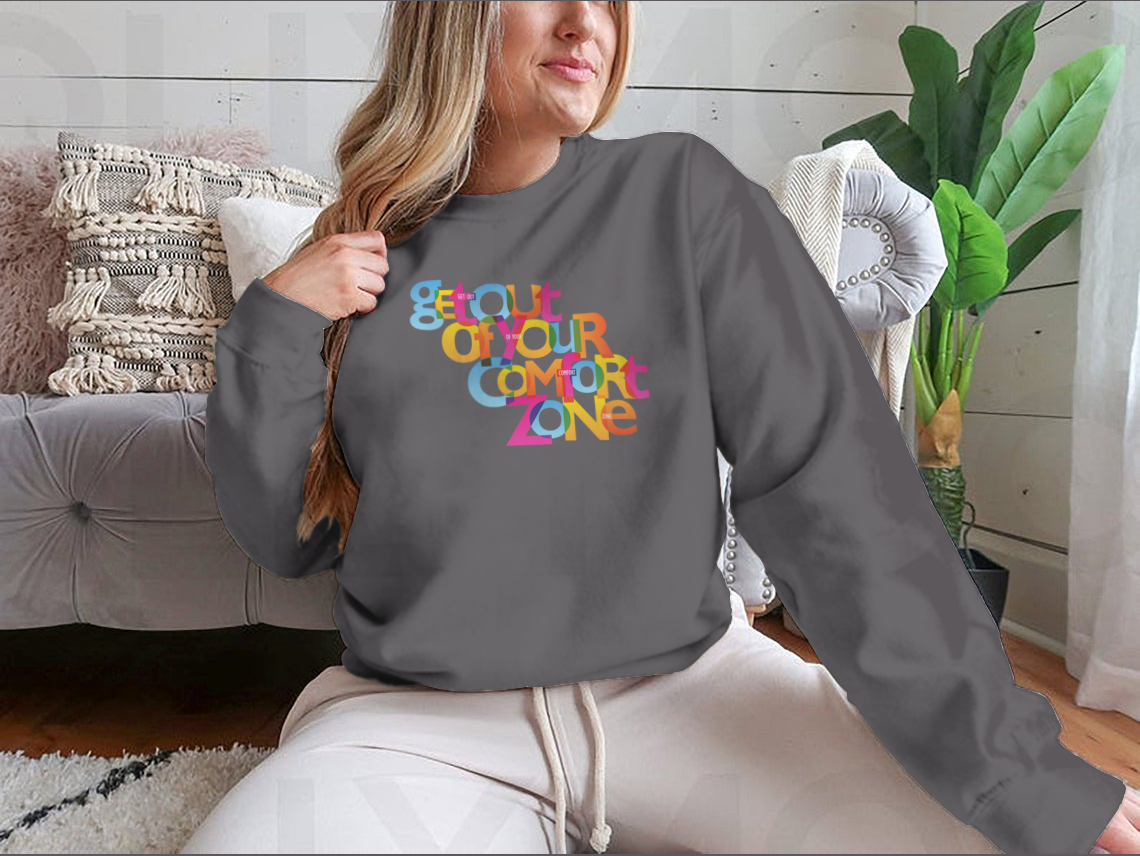 A stylish sweatshirt featuring the motivational phrase 'Get Out Of Your Comfort Zone', made from a soft cotton/polyester blend.