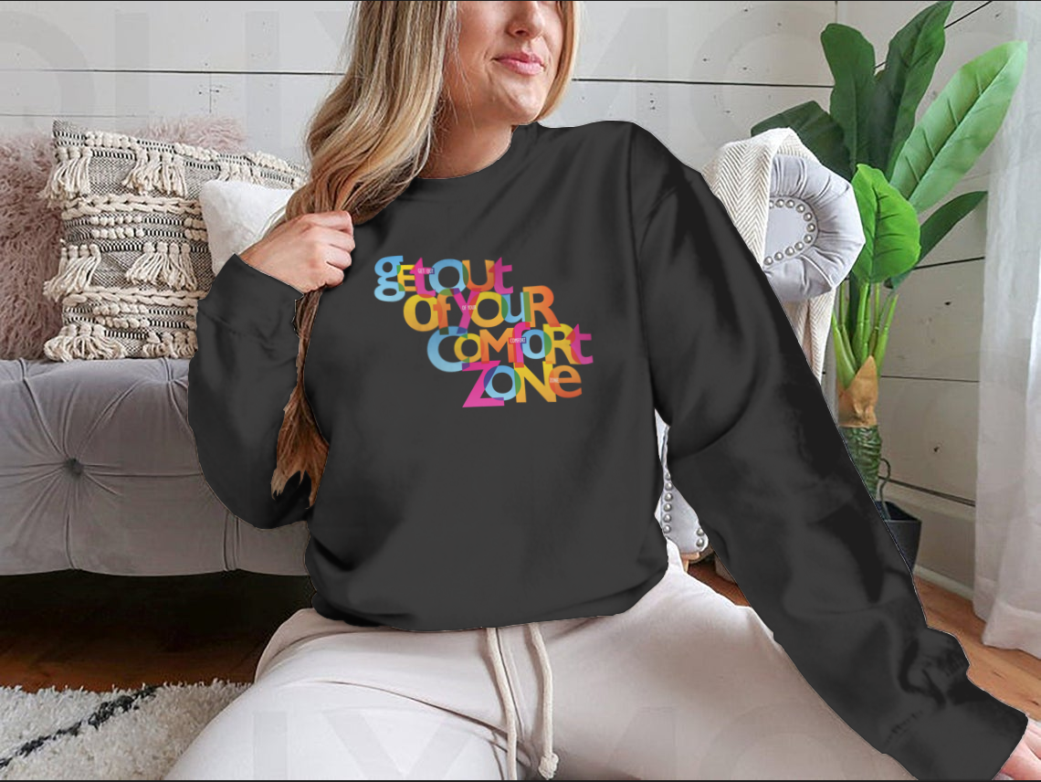 A stylish sweatshirt featuring the motivational phrase 'Get Out Of Your Comfort Zone', made from a soft cotton/polyester blend.