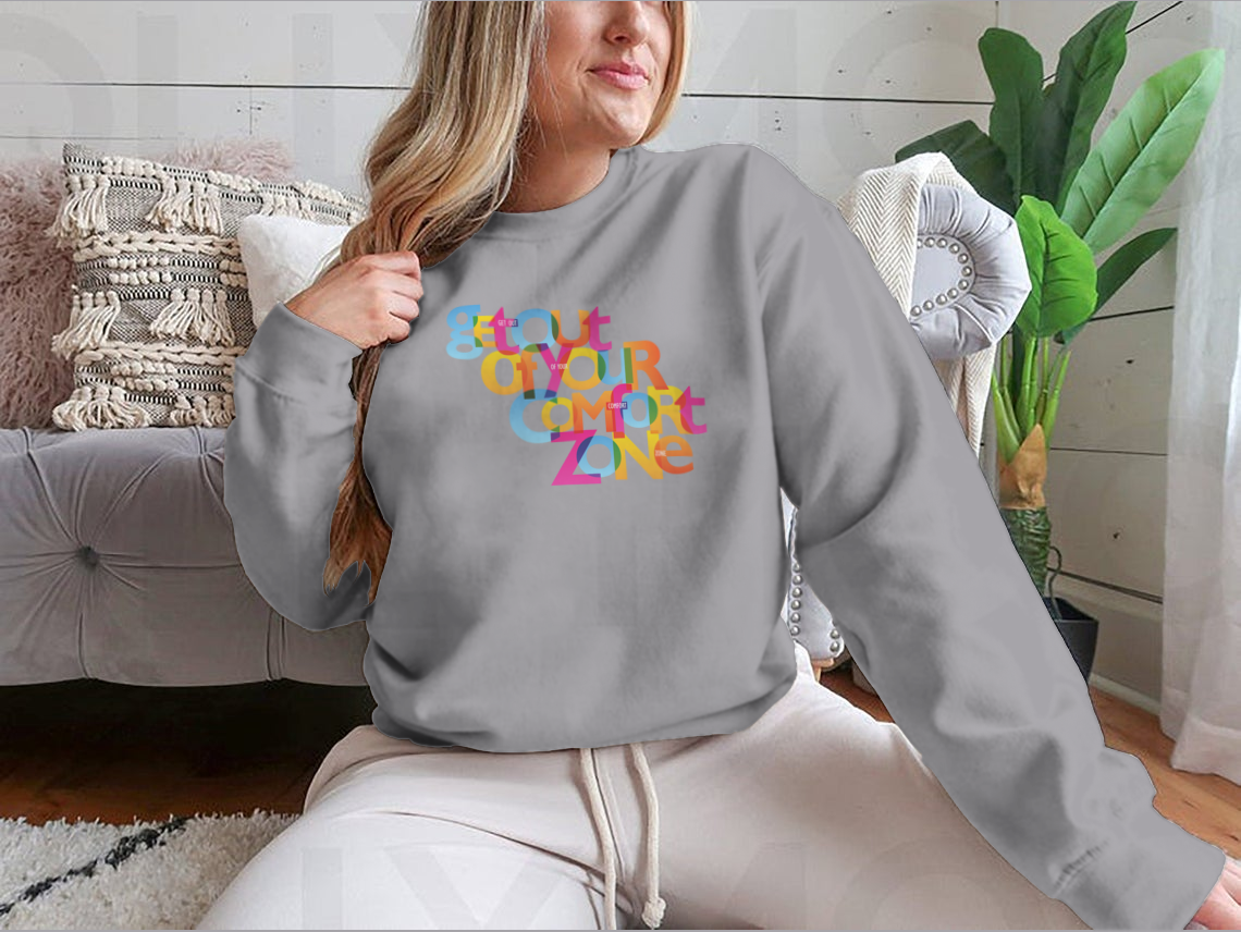 A stylish sweatshirt featuring the motivational phrase 'Get Out Of Your Comfort Zone', made from a soft cotton/polyester blend.