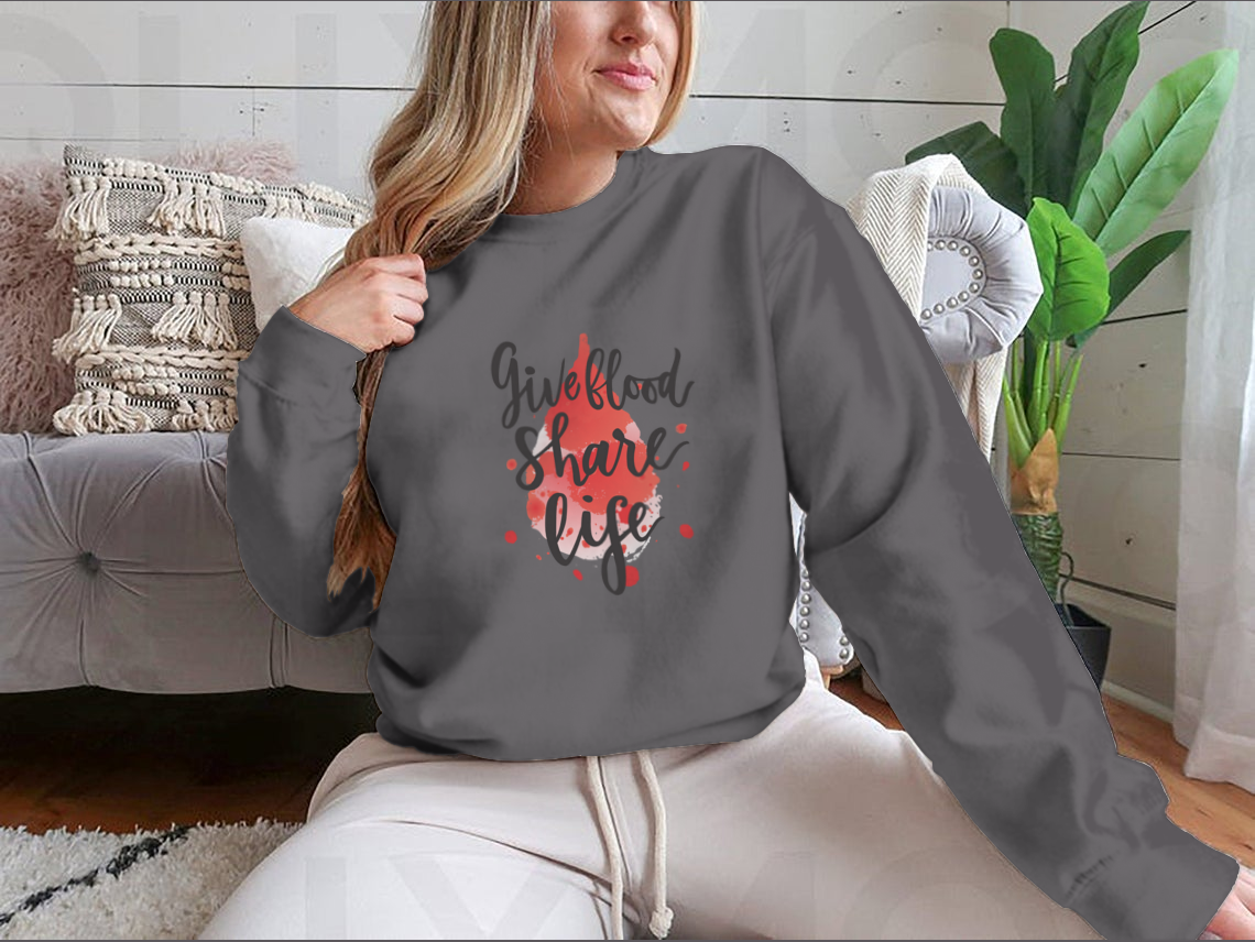 A stylish sweatshirt featuring a watercolor drop design with the phrase 'Give Blood Share Life', perfect for promoting blood donation awareness.