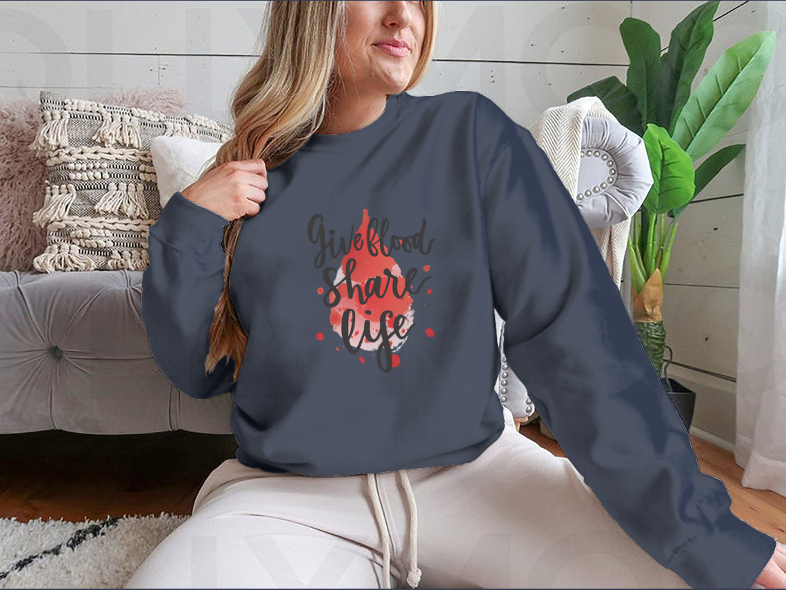 A stylish sweatshirt featuring a watercolor drop design with the phrase 'Give Blood Share Life', perfect for promoting blood donation awareness.