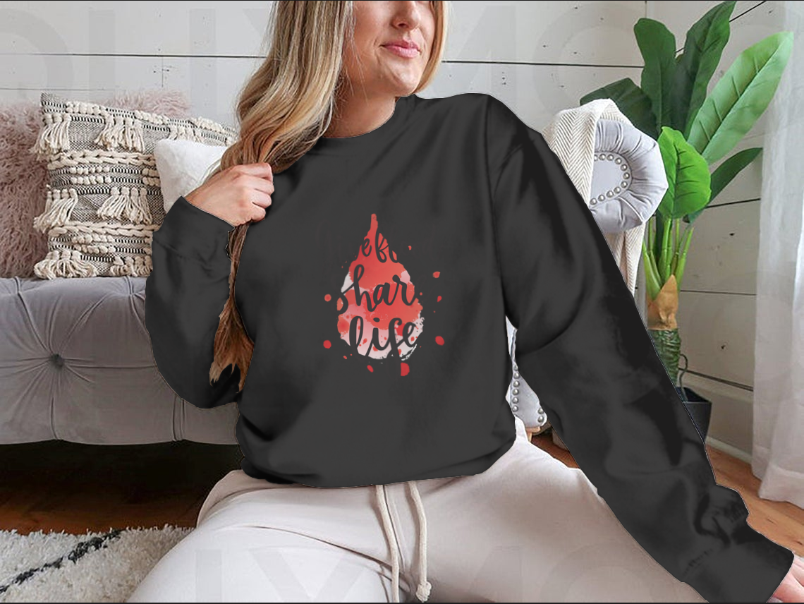 A stylish sweatshirt featuring a watercolor drop design with the phrase 'Give Blood Share Life', perfect for promoting blood donation awareness.