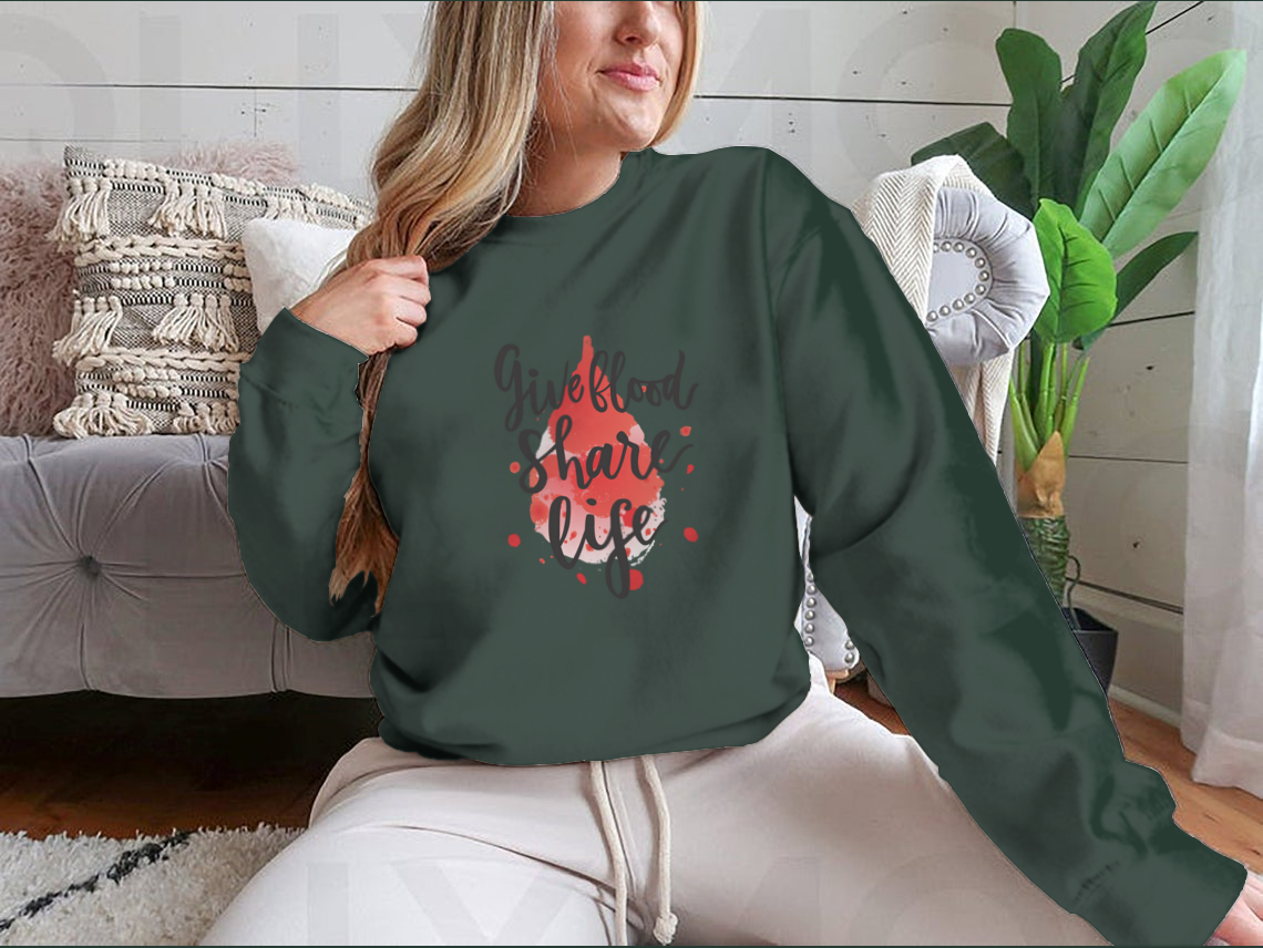 A stylish sweatshirt featuring a watercolor drop design with the phrase 'Give Blood Share Life', perfect for promoting blood donation awareness.