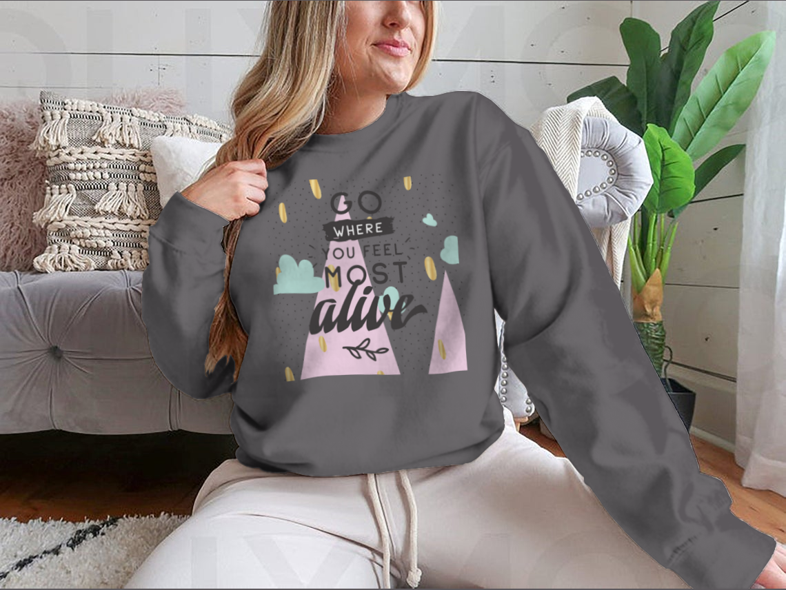 A cozy sweatshirt featuring the inspirational phrase 'Go Where You Feel Most Alive' in a stylish design, perfect for casual wear.