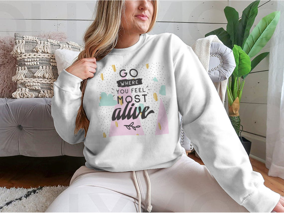 A cozy sweatshirt featuring the inspirational phrase 'Go Where You Feel Most Alive' in a stylish design, perfect for casual wear.