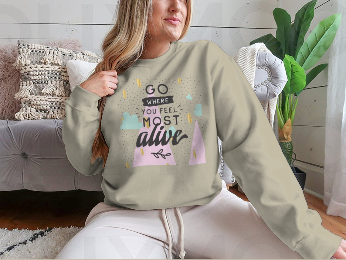 A cozy sweatshirt featuring the inspirational phrase 'Go Where You Feel Most Alive' in a stylish design, perfect for casual wear.