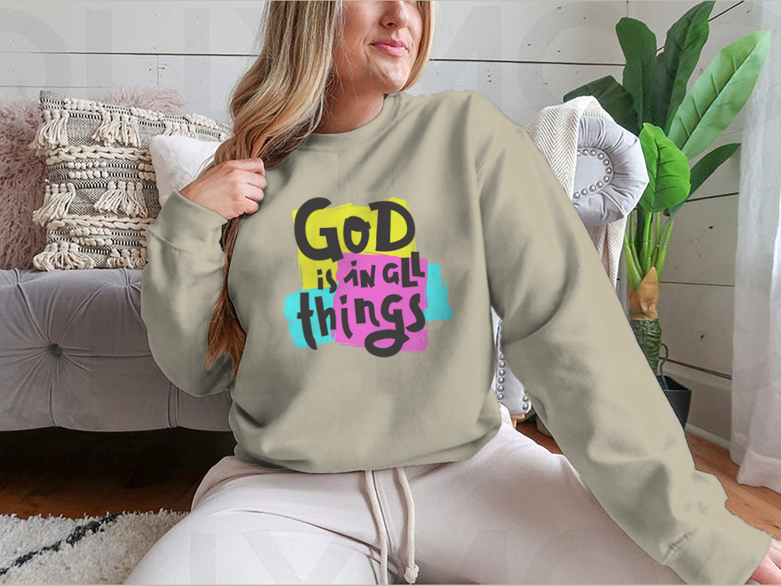 A cozy sweatshirt featuring the inspirational quote 'God Is In All Things' in a stylish design, perfect for everyday wear.