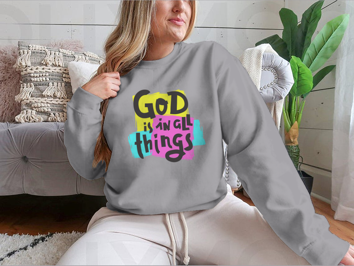 A cozy sweatshirt featuring the inspirational quote 'God Is In All Things' in a stylish design, perfect for everyday wear.