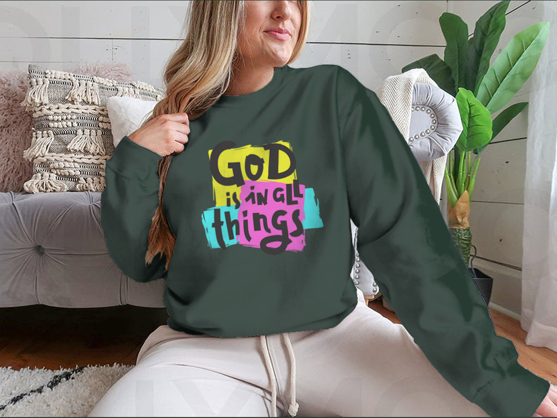 A cozy sweatshirt featuring the inspirational quote 'God Is In All Things' in a stylish design, perfect for everyday wear.