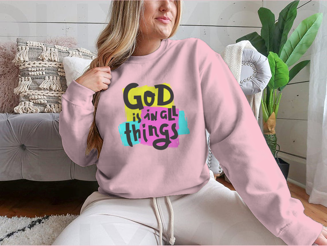 A cozy sweatshirt featuring the inspirational quote 'God Is In All Things' in a stylish design, perfect for everyday wear.