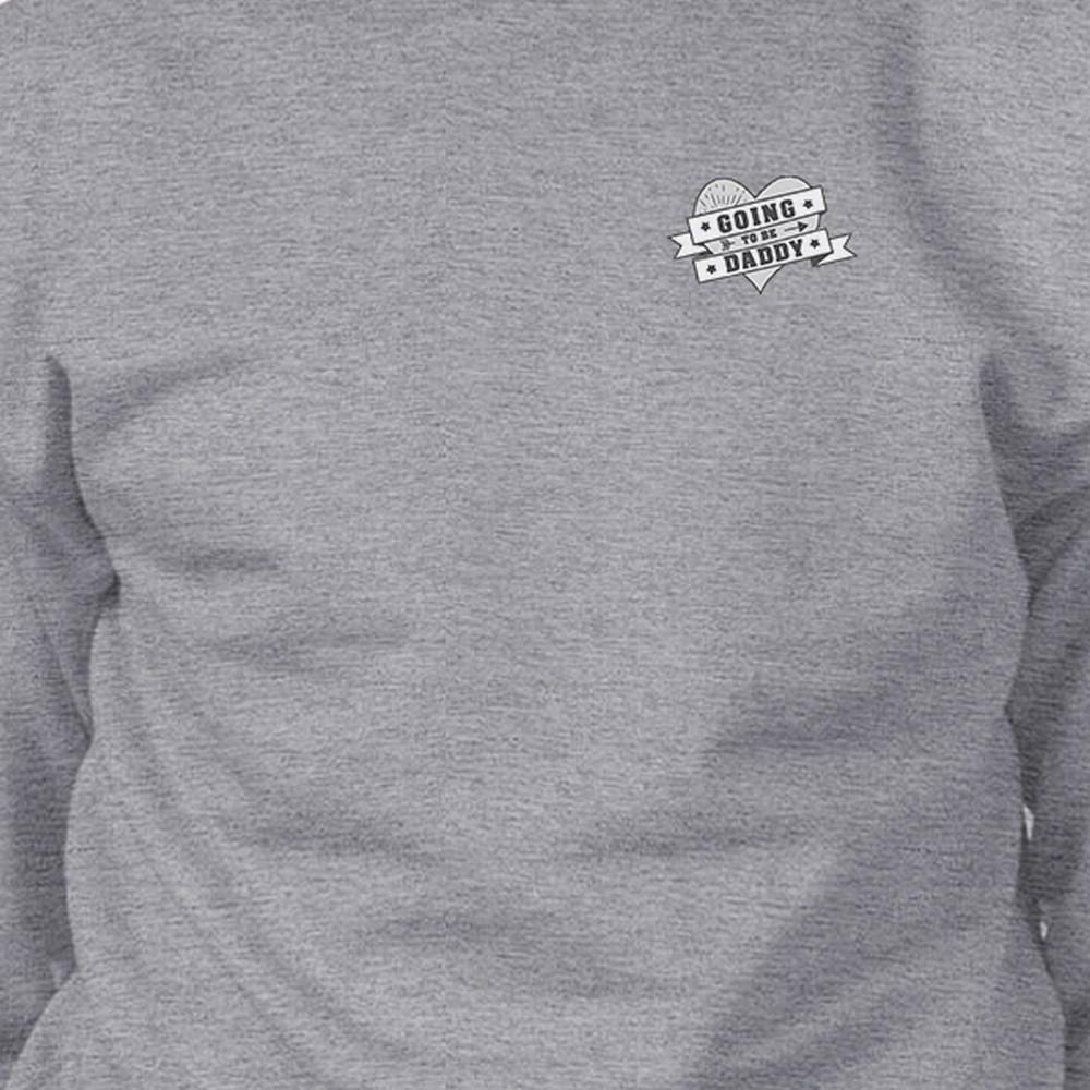 Unisex sweatshirt with 'Going To Be Daddy' design, made of soft cotton blend, perfect for pregnancy reveal.