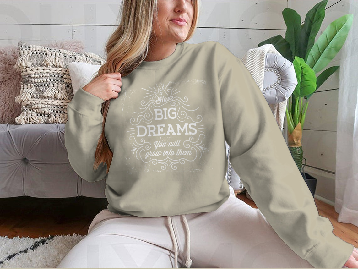 A stylish hand lettering quote design featuring 'Have Big Dreams You Will Grow Into Them' on a comfortable cotton/polyester blend fabric.