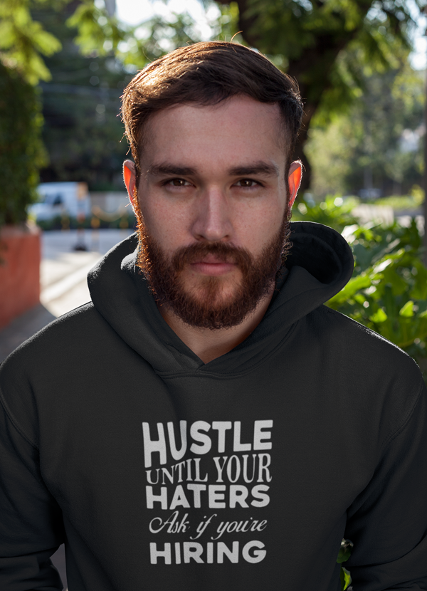 Hustle Until Haters Hoodie featuring a cozy fleece lining and adjustable hood, perfect for stylish comfort.